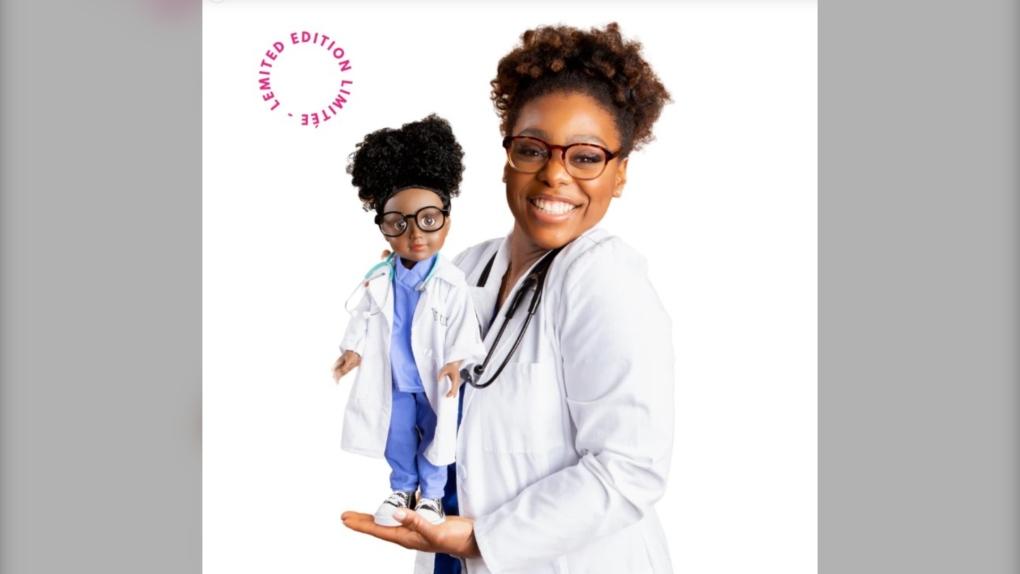 Dr. Alexandra Bastiany, wearing black framed glasses, a white lab coat, stethoscopes, and her hair tied up, poses with her namesake doll